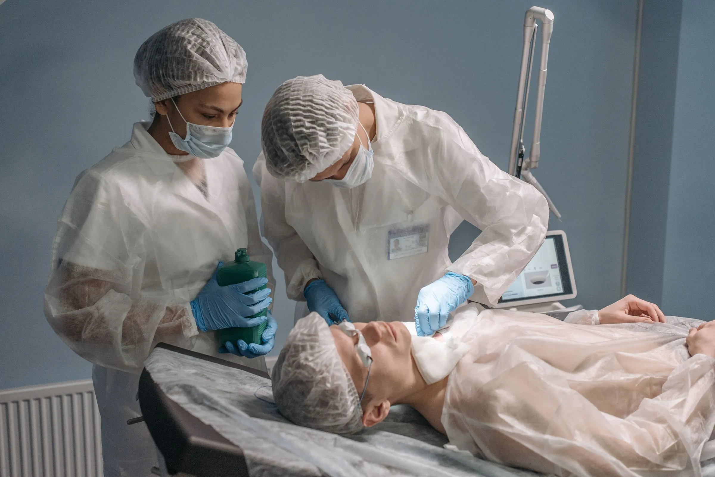 Clinicians working in a sterile procedure room