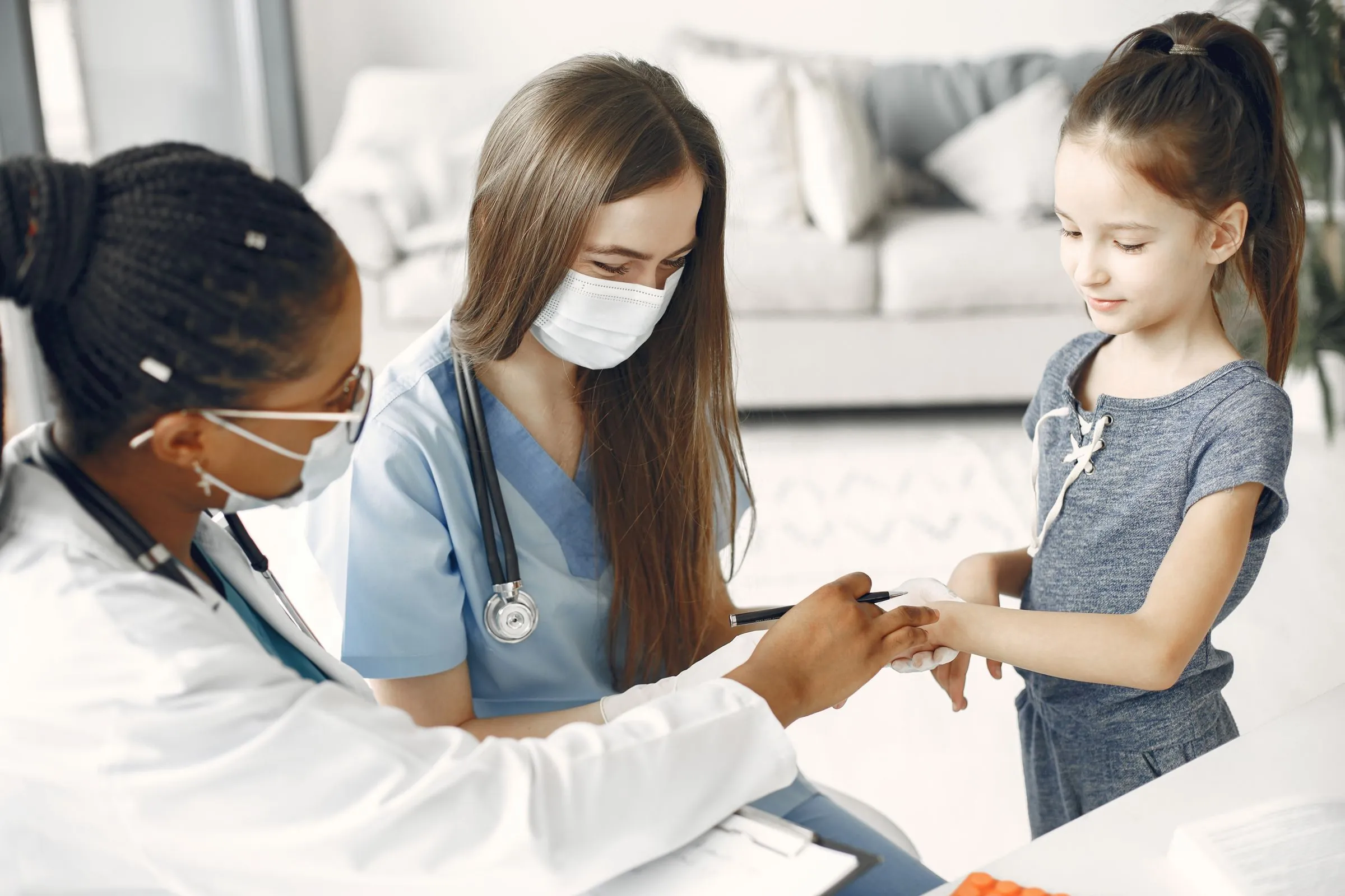 Clinicians attending to a patient during a health assessment