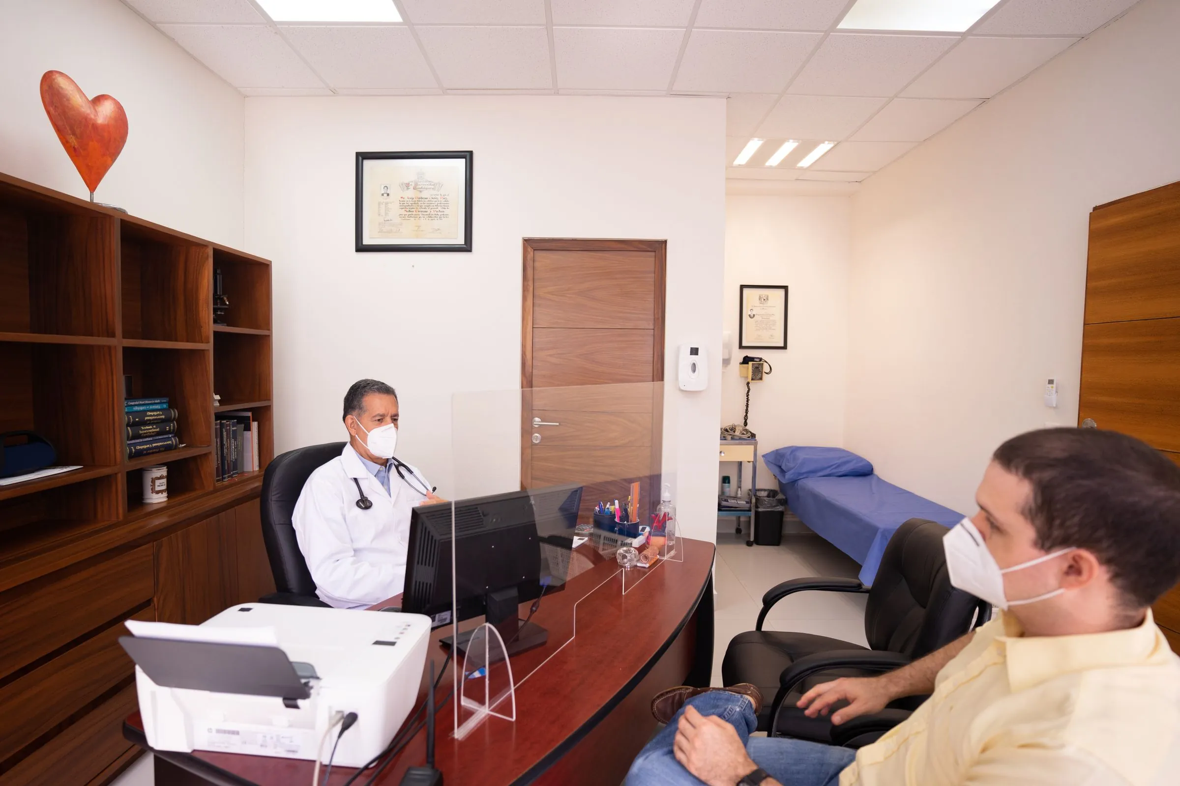 A doctor and patient in consultation at a medical clinic