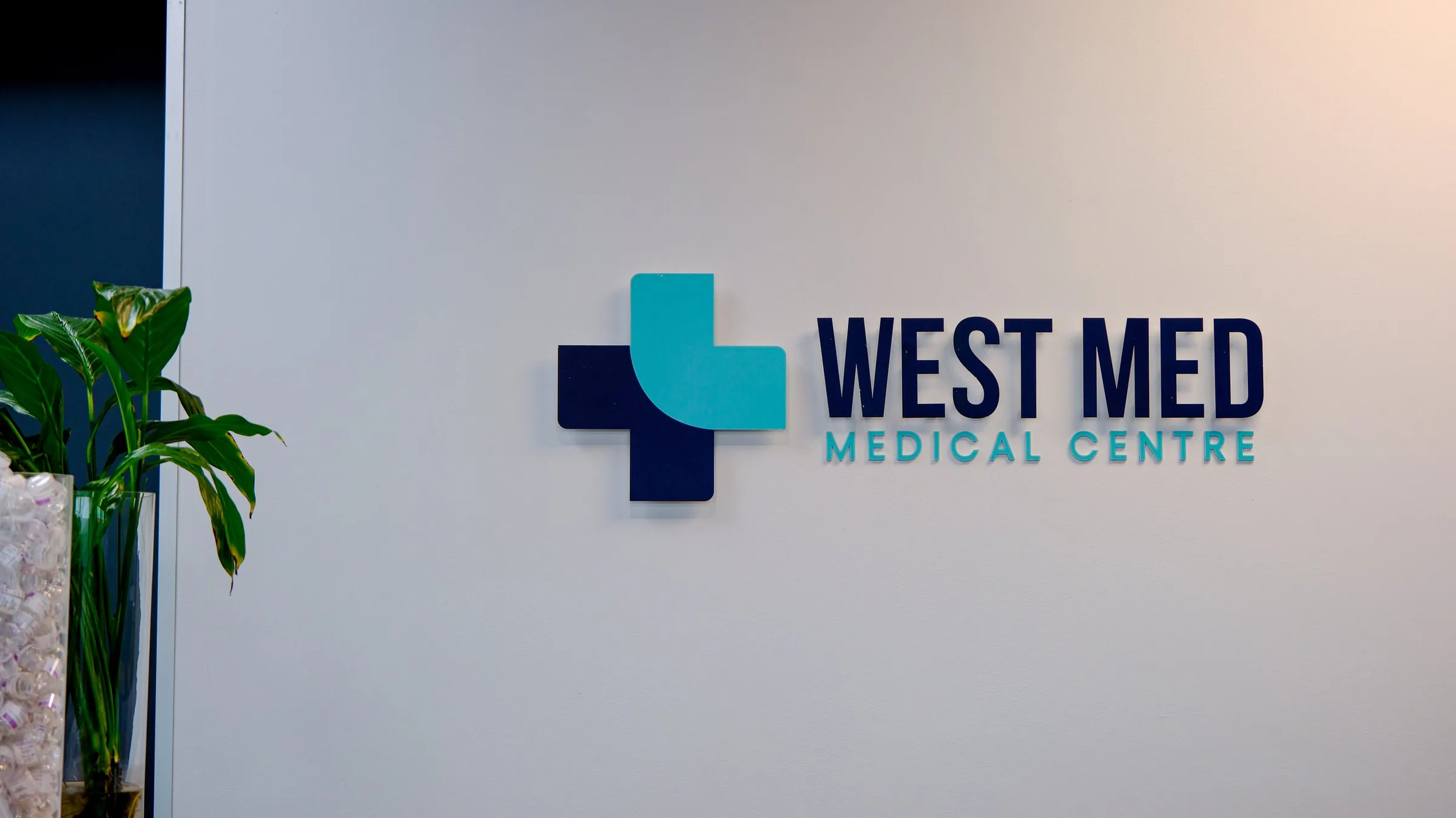 The West Med Medical Centre sign in a branch reception